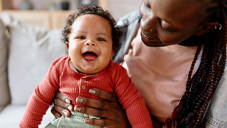 Happy-Baby-Laughing-On-Mother's-Lap